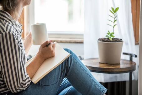 Woman relaxing in clean home.