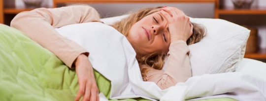 Woman with a headache from mold exposure